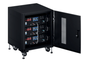 An image of a server rack type battery comprising of 3 battery units in a server rack. The door is pen and we can see the batteries inside.
